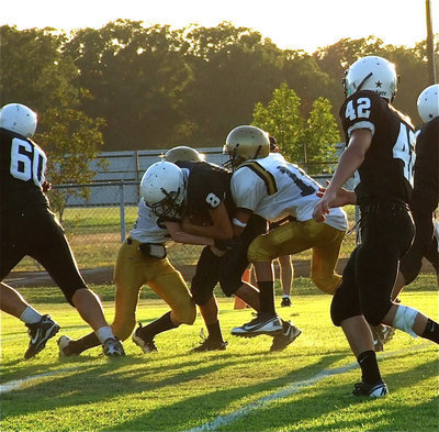 Image: Italy’s Ty Windham(12) and Ryan Connor(13) combine for the tackle.