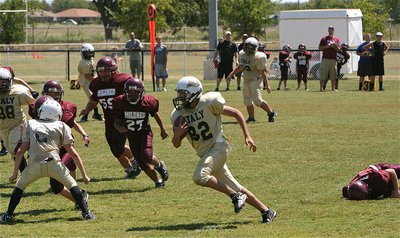 Image: IYAA A-Team defender Jonathan Salas(82) intercepts two Mildred passes during the season opener.