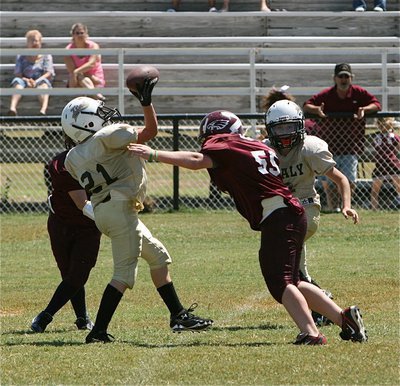 Image: A-Team’s Cade Brewer(21) tries to make something happen during a botched punt attempt.