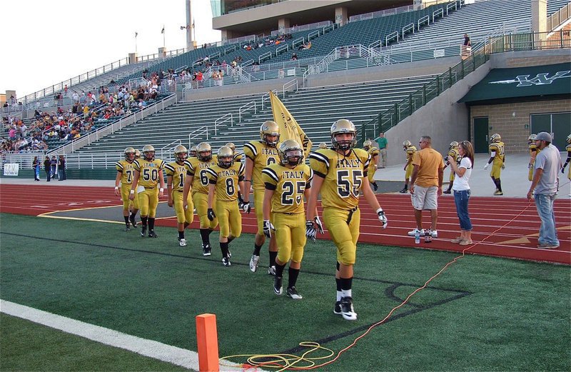 Image: Senior Gladiator Zackery Boykin(55) leads his team into battle against the Malakoff Tigers at Stuart B. Lumpkins Field in Waxahachie.
