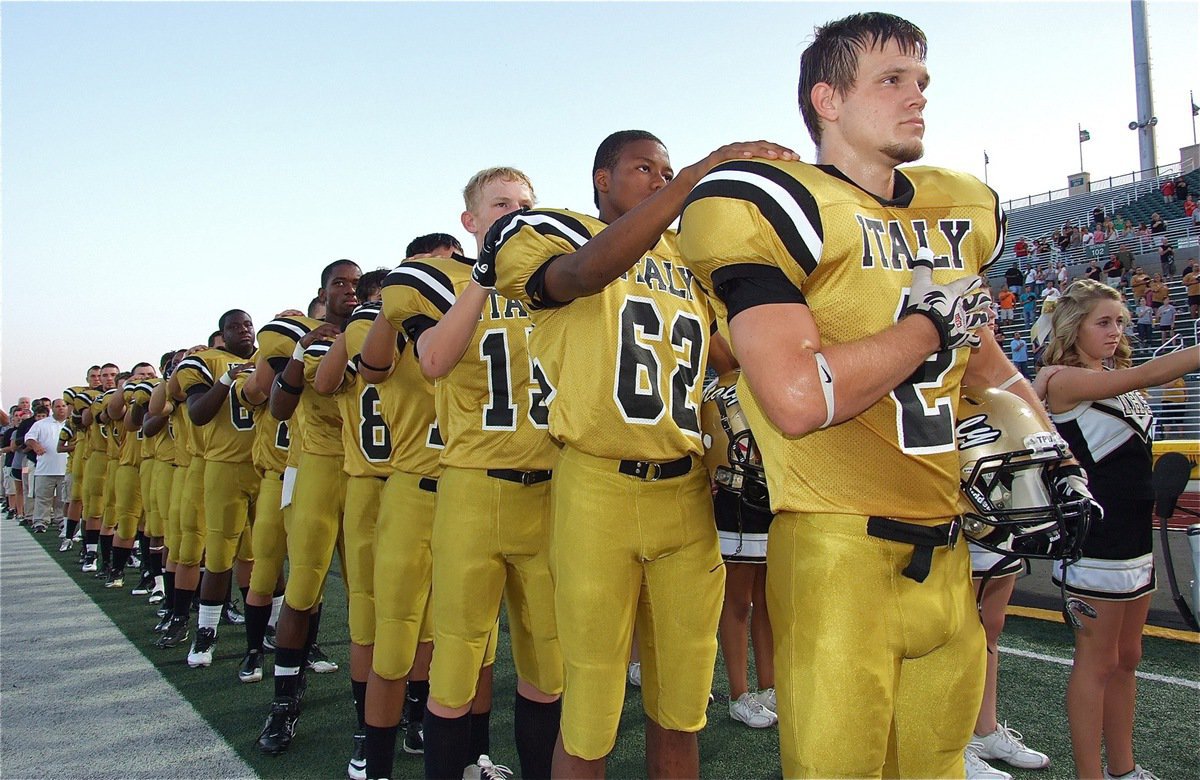Image: The Gladiators pay tribute to the United States flag.