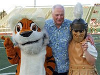 Image: Dale Hansen and the team mascots before the start of the Friday night addition of the inaugural 2012 Dale Hansen Football Classic between Malakoff and Italy. Representing the Gladiators is mascot Reagan Adams.