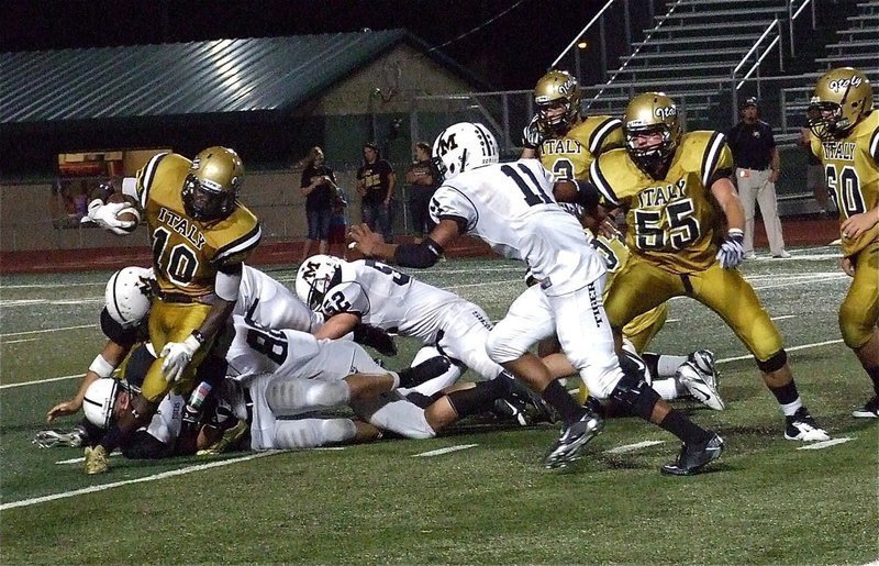 Image: Ryheem Walker(10) fights for yards against Malakoff’s defense.