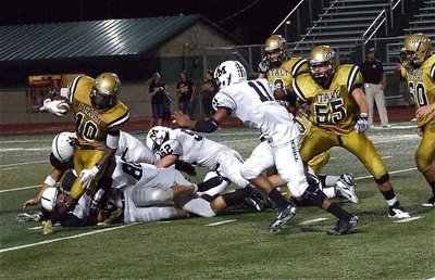 Image: Ryheem Walker(10) fights for yards against Malakoff’s defense.