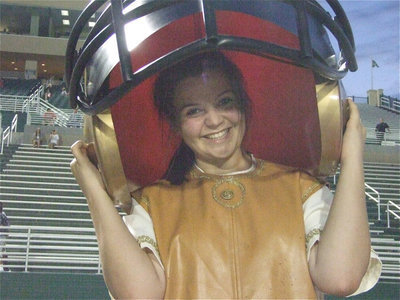 Image: Gladiator mascot Reagan Adams tries on a larger than life Gladiator helmet.