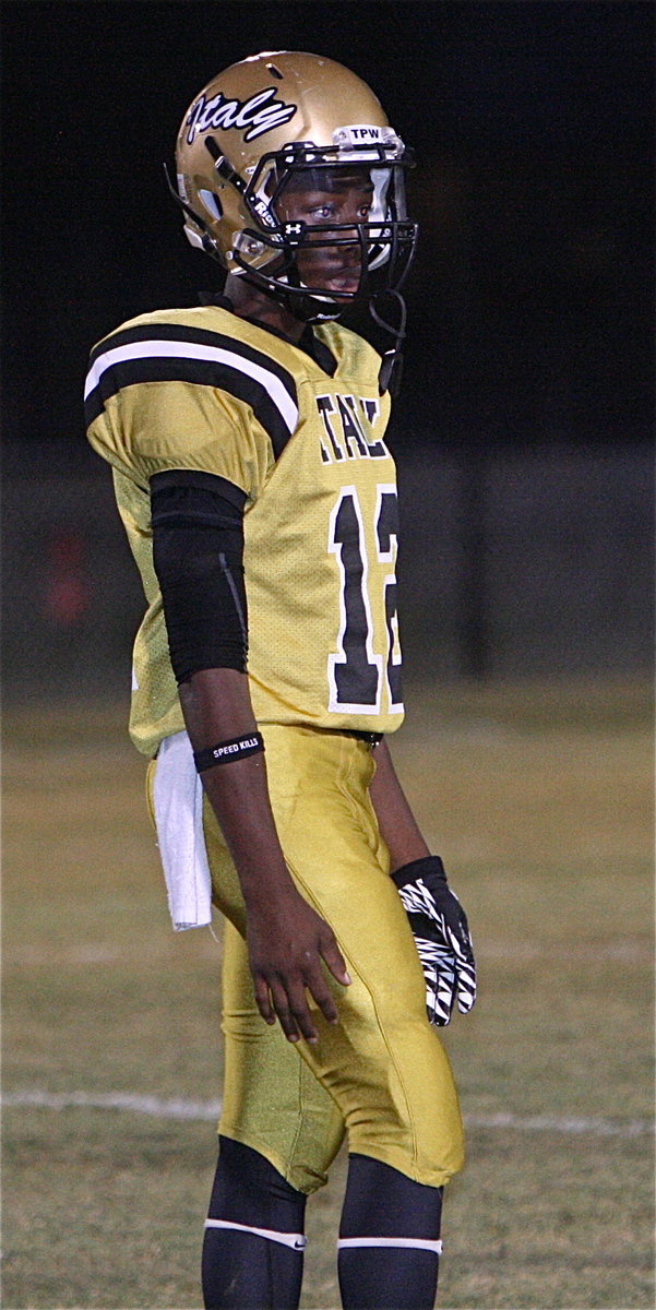 Image: Gladiator junior quarterback Eric Carson(12) gets the play from the sideline during the Sunnyvale game.