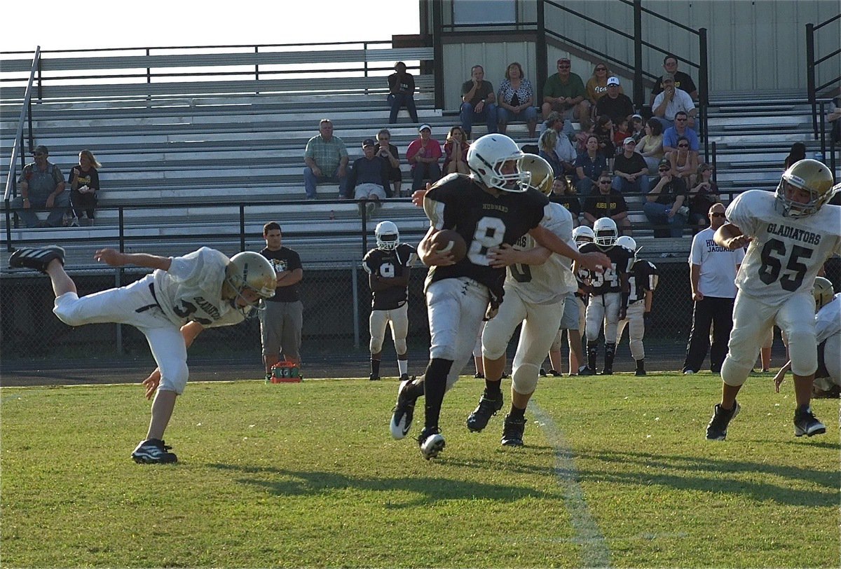Image: Dylan McCasland(32) flushes Hubbard’s quarterback out of the pocket and then Clay Riddle(60) tracks him down.