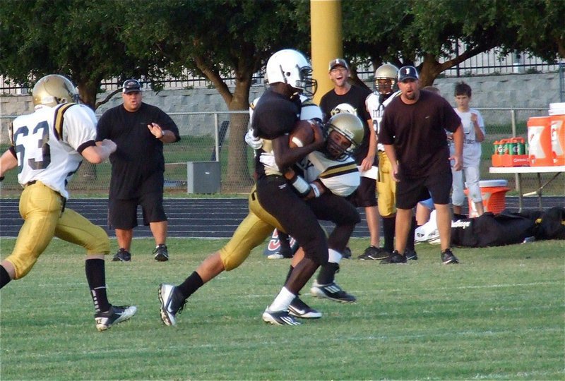 Image: Levi McBride(10) comes up to contain the edge from his cornerback position and the Gladiator coaching staff loves the hit!