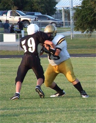 Image: Italy’s John Byers(75) gets the job done at right offensive tackle for Italy’s JV offense.