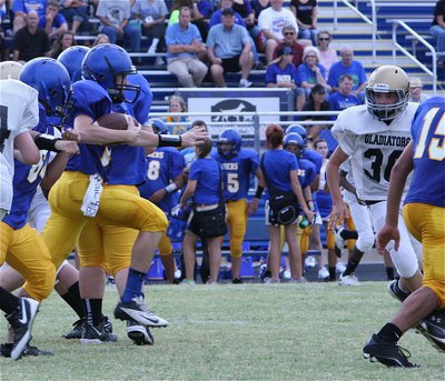 Image: 8th grader Gladiator Blake Brewer(30) zeroes in on a Sunnyvale runner.
