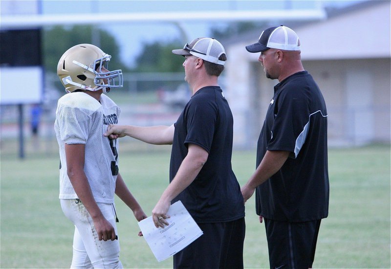 Image: Coaches Josh Ward and Hank Hollywood send Devonteh Williams(9) in with the play.