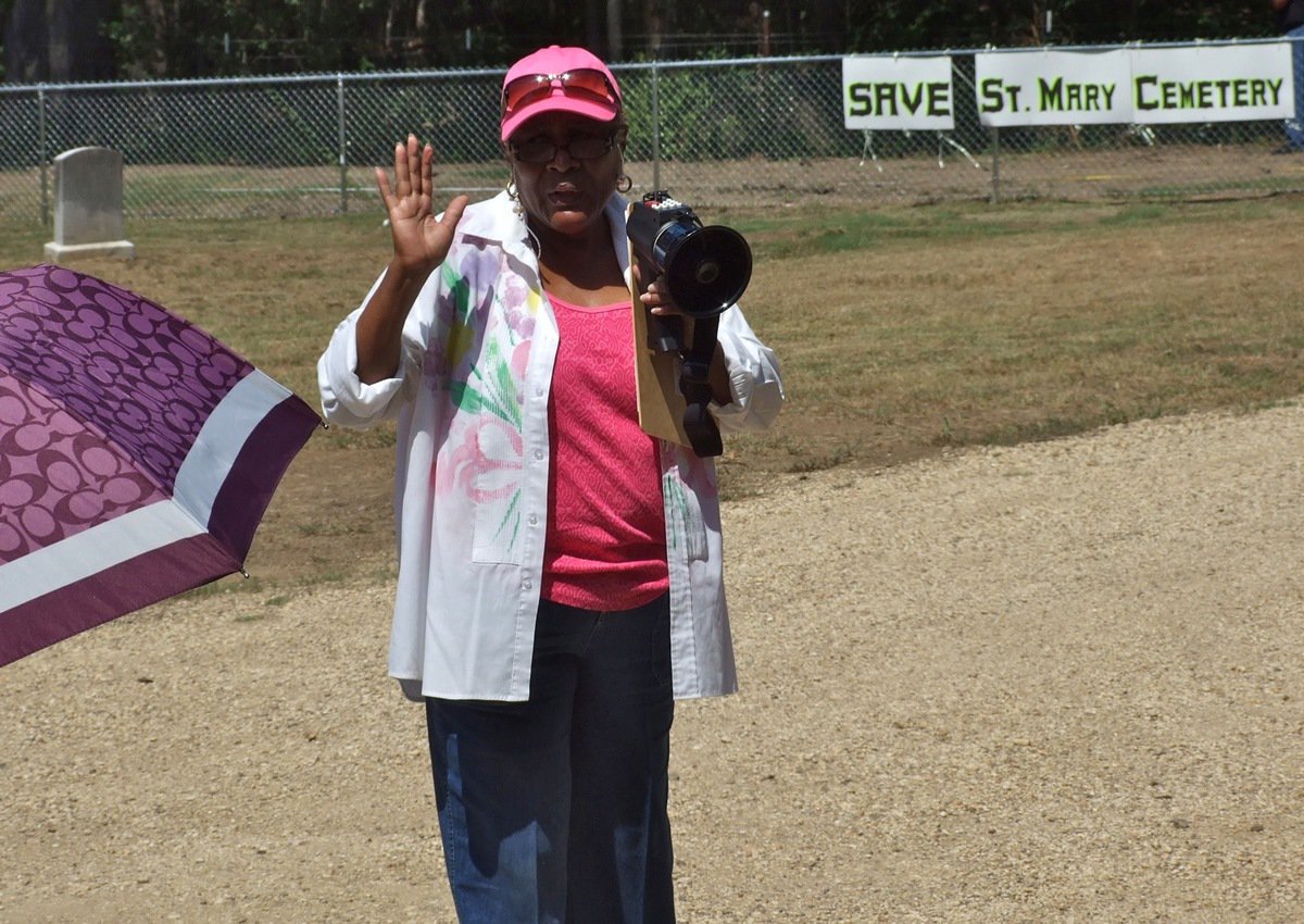 Image: On a mission to SAVE St. Mary Cemetery is local activist Elmerine Bell of Italy, Texas. Bell who speaks to fellow activist and supporters that drove in from around Ellis County and across the state to witness first hand the damage created by the Creek Land & Cattle Company at the historic location.