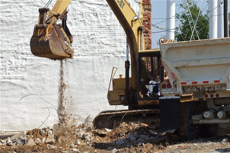 Image: Dirt, concrete and metal being removed.