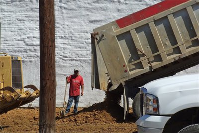 Image: Sand is delivered to help level the area.