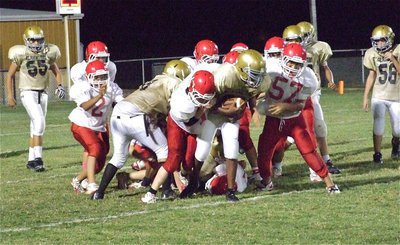 Image: Italy’s Jarvis Harris(89) rumbles forward for extra yardage thru the Hico defense.