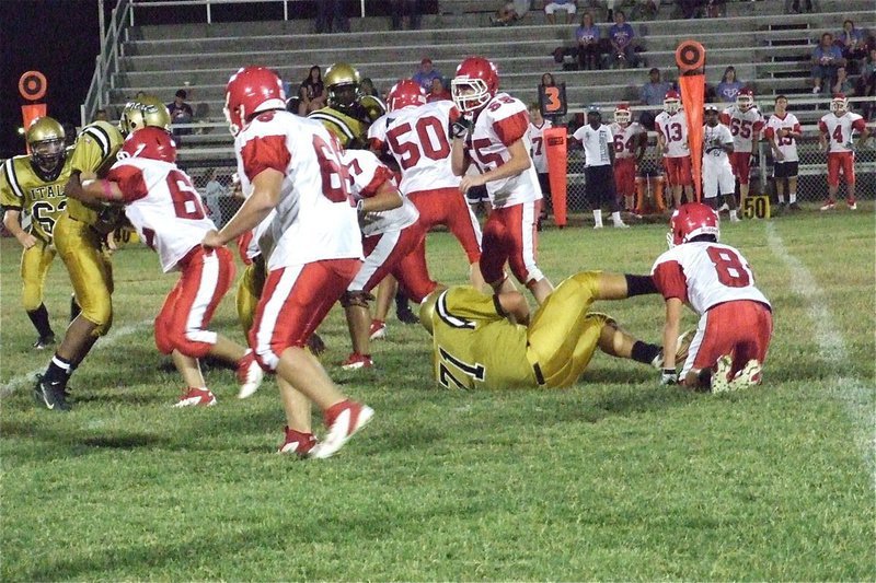 Image: Defensive tackle Colin Newman(71) recovers a fumble for his mom who was in the stands to watch him play.