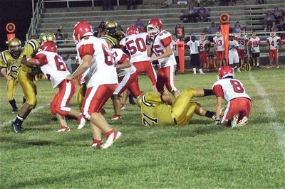 Image: Defensive tackle Colin Newman(71) recovers a fumble for his mom who was in the stands to watch him play.