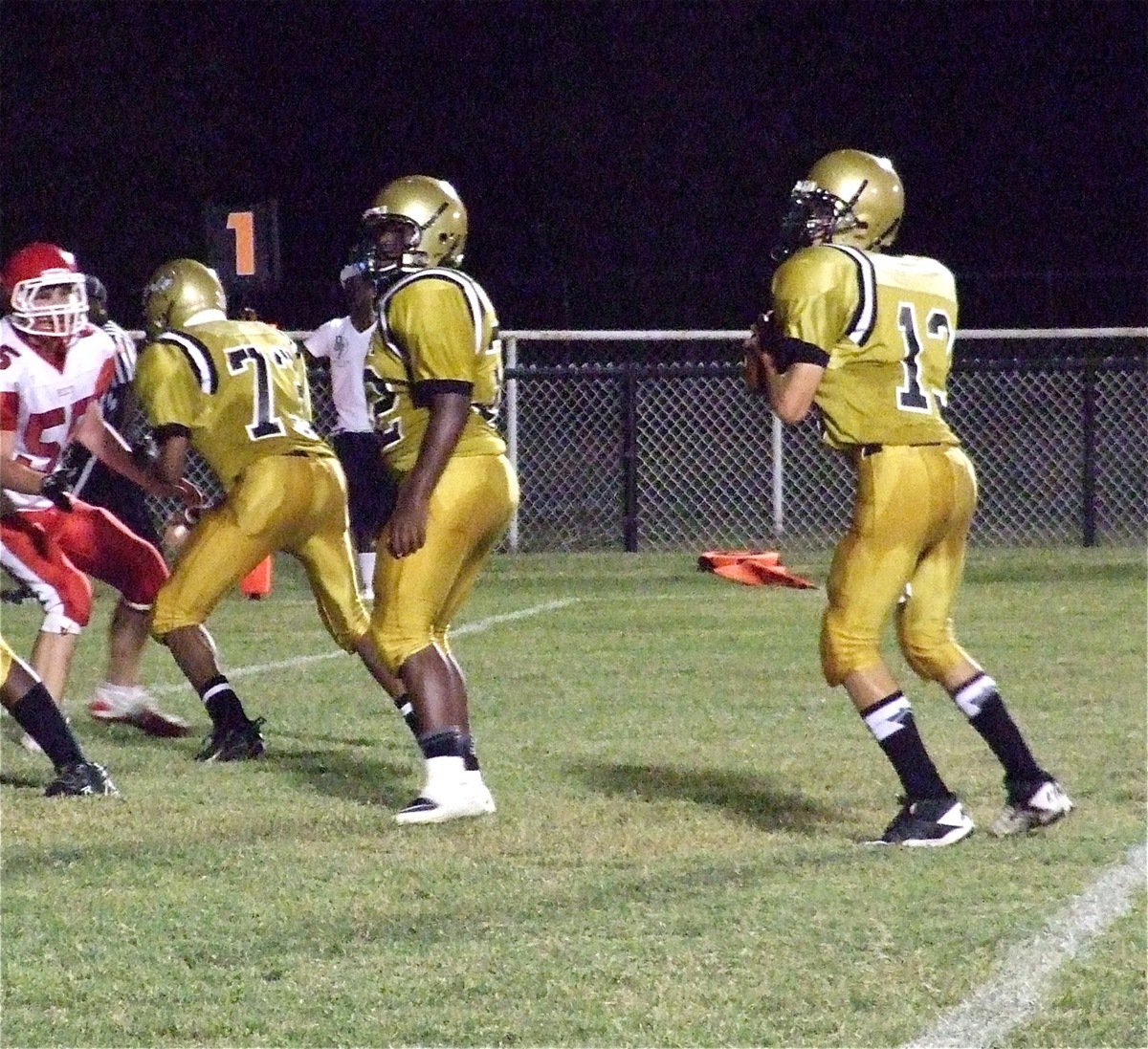 Image: John Hughes(73) and Billy Moore(32) practically dare Hico’s defense to cross the scrimmage line while protecting quarterback Ryan Connor(13).