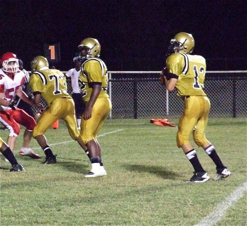 Image: John Hughes(73) and Billy Moore(32) practically dare Hico’s defense to cross the scrimmage line while protecting quarterback Ryan Connor(13).