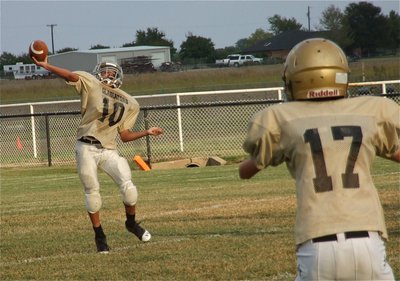 Image: Ty Hamilton(17) gets open as Tylan Wallace(10) passes the ball downfield to his receivers.