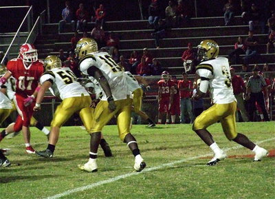 Image: Zain Byers(50) and Ryheem Walker(10) pass protect for Marvin Cox(3).