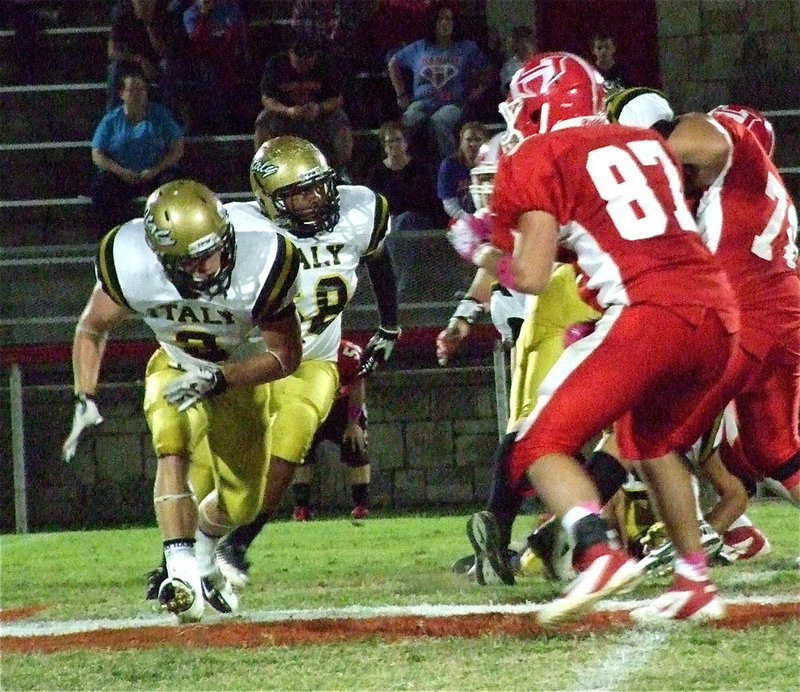 Image: Chase Hamilton(2) and Darol Mayberry(58) prepare to chop down Tiger defenders.