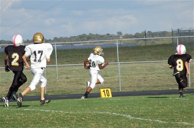 Image: Kendrick Norwood(20) reaches the end zone with Ty Hamilton(17) tracking the ball for Italy.