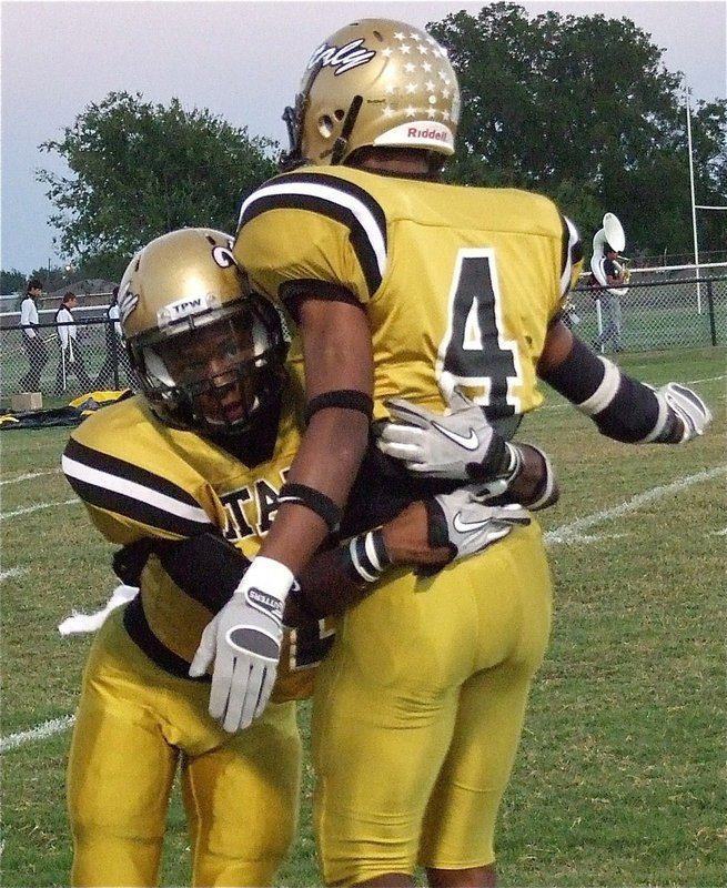 Image: Eric Carson(12) and teammate Trevon Robertson(4) work on tackling drills before tackling the Wampus Cats.