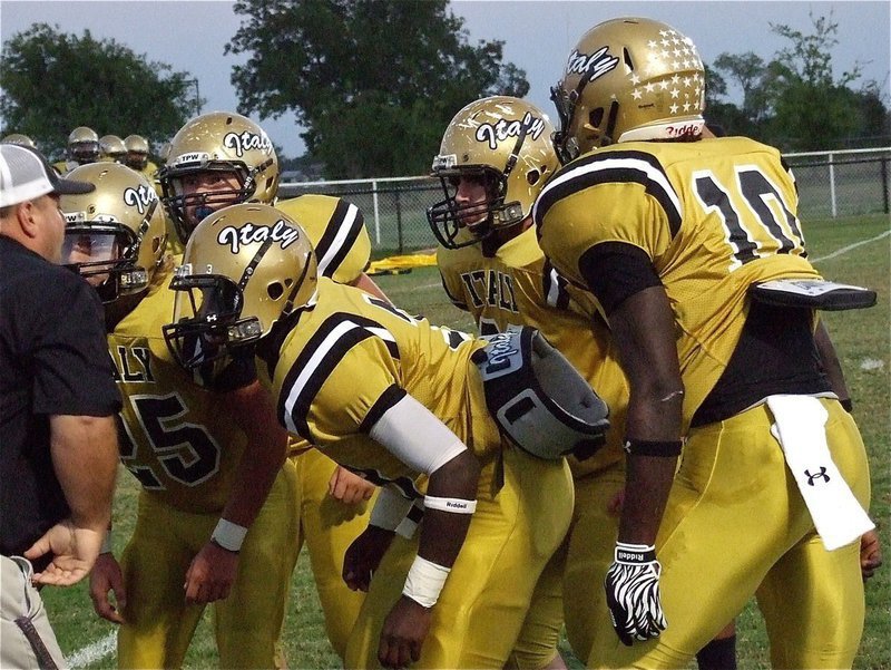 Image: Coach Brain Coffman breaks down Shad Newman(25), Zain Byers(50), Marvin Cox(3), Kyle Fortenberry(66) and Ryheem Walker(10).