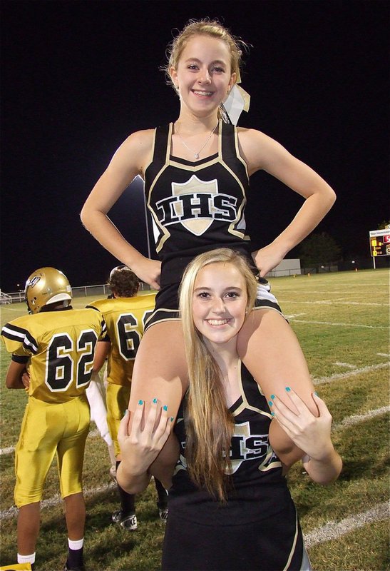 Image: Gladiator cheerleaders Kelsey Nelson and Britney Chambers help Italy reach a new level against Itasca.
