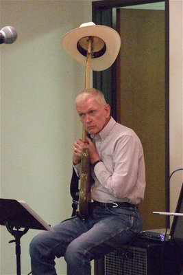 Image: Ray Lowry is at one with his guitar during a pause between sets.