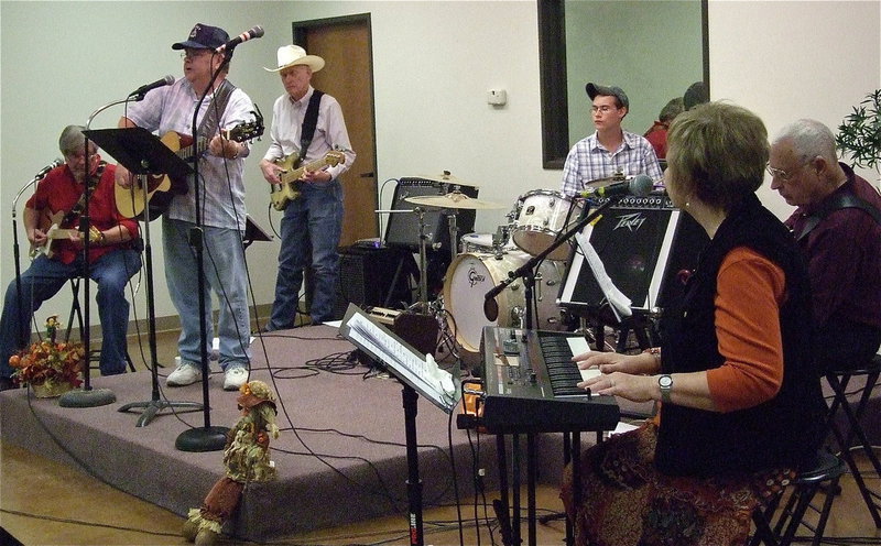 Image: Brad Daniels leads the Good Timers Band in a song.
