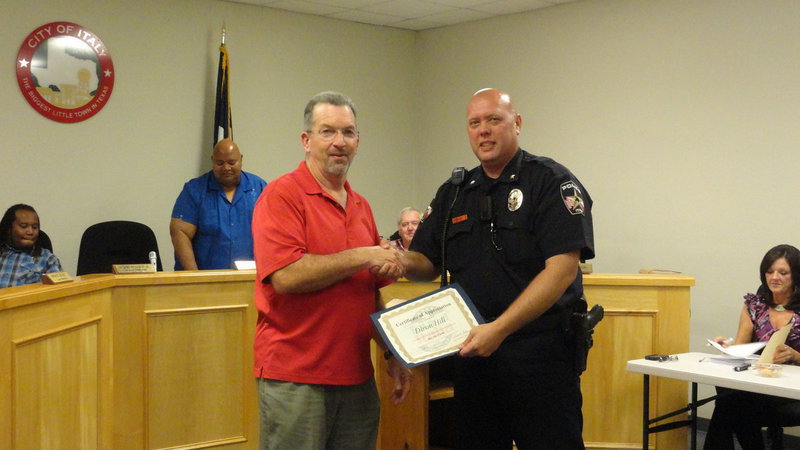 Image: Lone Star Cyclists President Paul Tate thanks Italy Police Chief Diron Hill for his help with annual Tour d’Italia