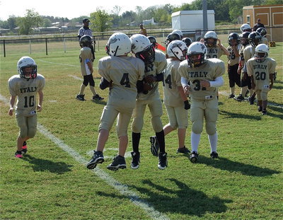 Image: Julius Wilson(33) congratulates Bryce DeBorde(4) above the goal line DeBorde scores a touchdown for the B-Team Gladiators.