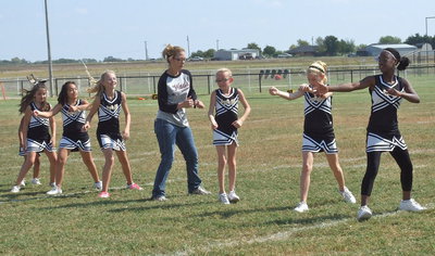 Image: Line Dance Fail: NEH league president, Janie Adair, busts a move with the IYAA A-Team Cheerleaders during halftime.