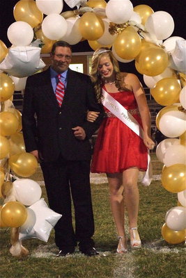 Image: 2012 IHS Homecoming Princess Madison Washington is escorted by her grandfather David McClendon.