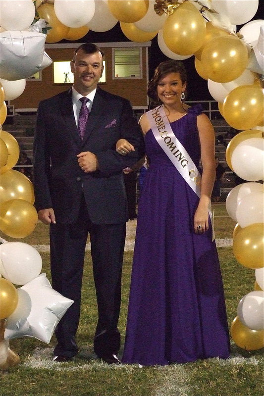 Image: 2012 IHS Homecoming Queen nominee Morgan Cockerham is escorted by her father Paul Cockerham.