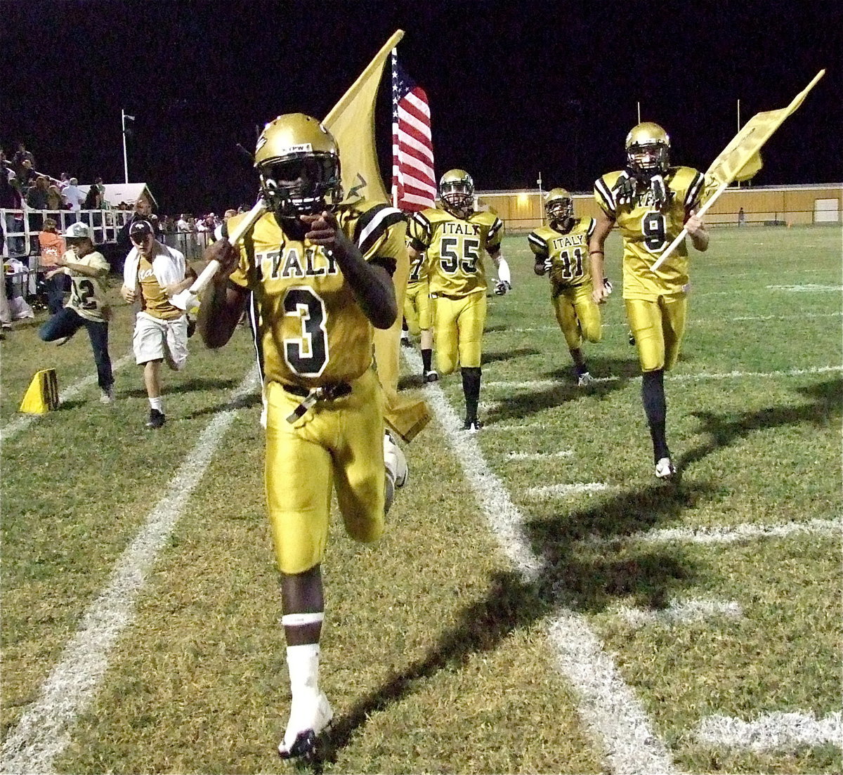 Image: Marvin Cox(3), Cole Hopkins(9), Zackery Boykin(55) and Reid Jacinto(11) lead their teammates out for the second half with water boys Dylan McCasland and Clay Riddle keeping pace.