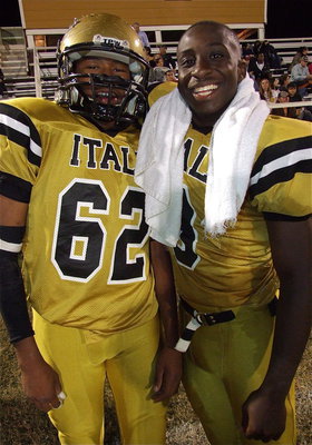 Image: Marvin Cox(3) congratulates teammate John “Squirt” Hughes(62) who was cheered on by Gladiator fans to the chant of, “Let’s go, Squirt, Let’s go Squirt!”