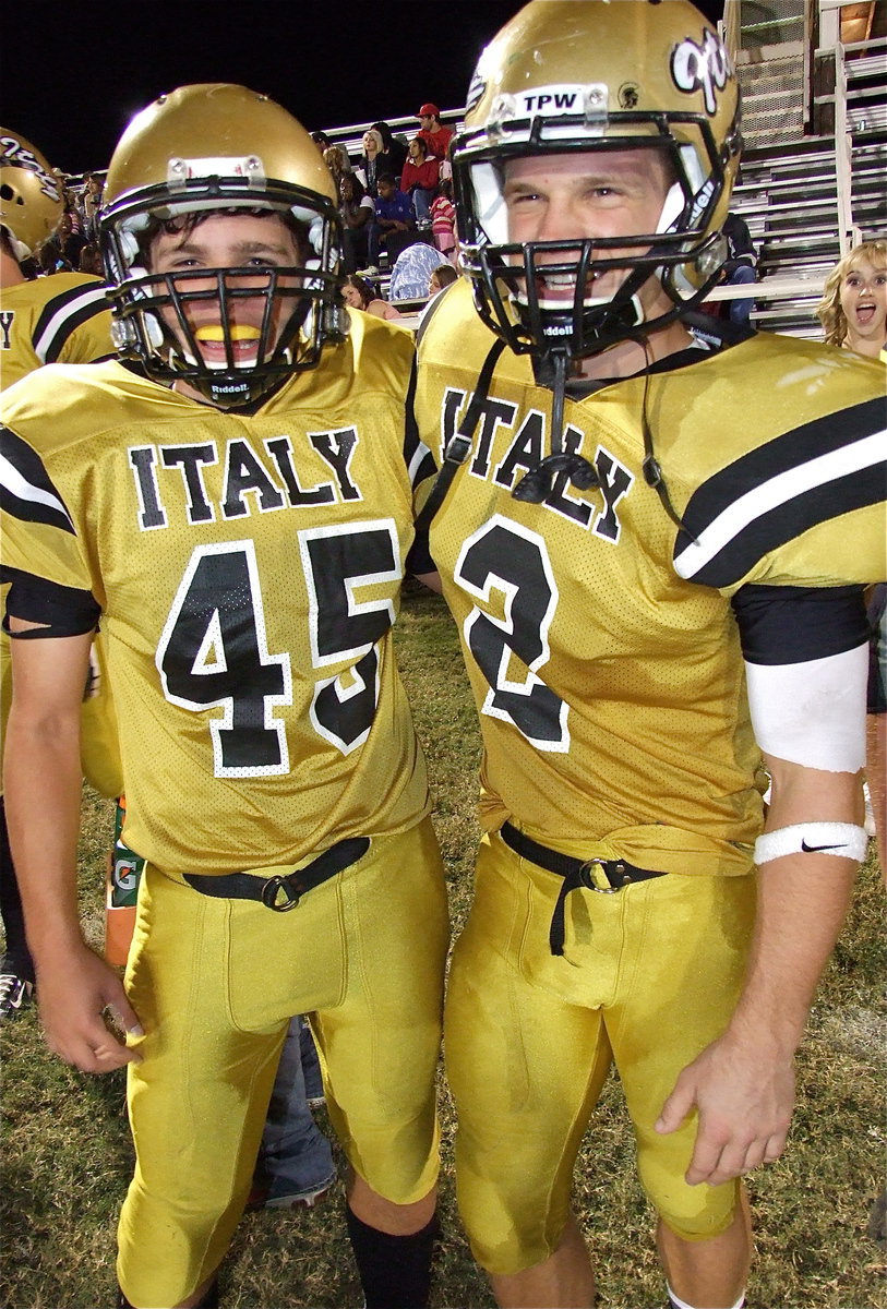 Image: Hunter Merimon(45), moved up from the JV squad for the homecoming game against Cross Roads, is congratulated by Chase Hamilton(2) who is proud of Merimon’s game accomplishments. Merimon had 4 tackles on defense with 3 solos including 1 sack, as well as, a carry of 8 yards on offense.