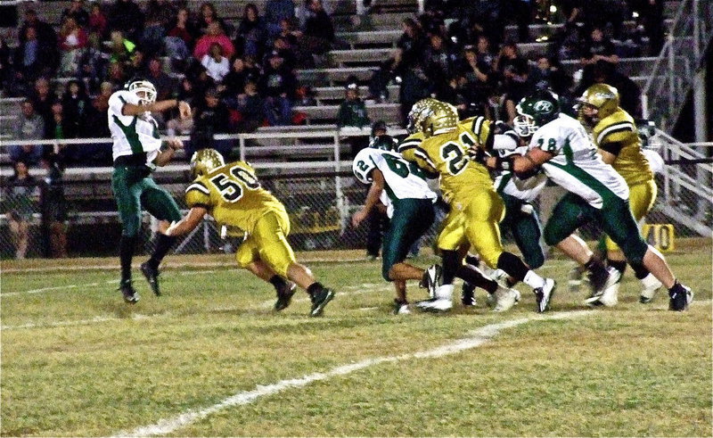 Image: Zain Byers(50) applies pressure forcing an incomplete pass attempt by the Bobcats during the first-quarter.