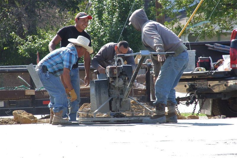 Image: Crews begin to finish the surface.