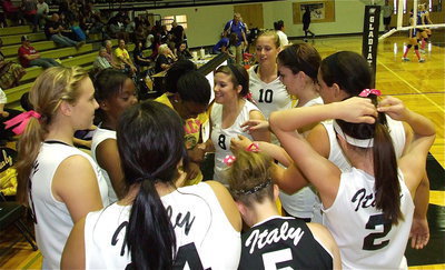 Image: Lady Gladiator head coach Jessika Robinson shares a light moment with her team during a timeout.