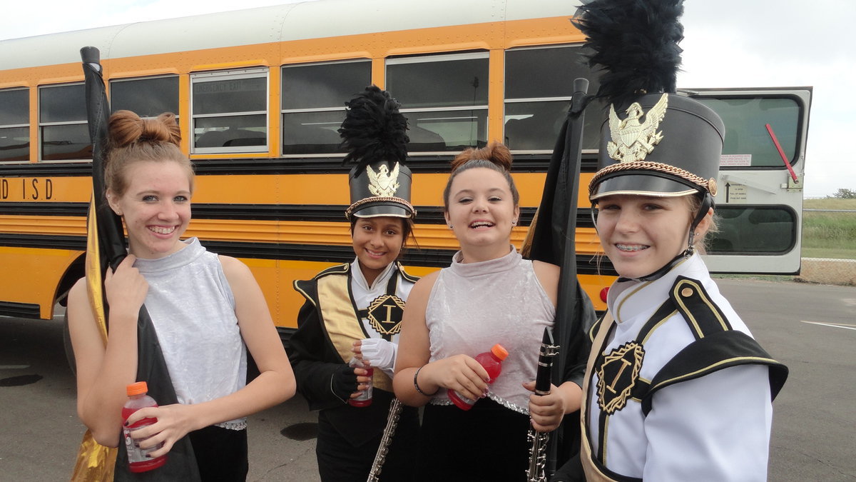 Image: Band and flag corp members get ready to perform.