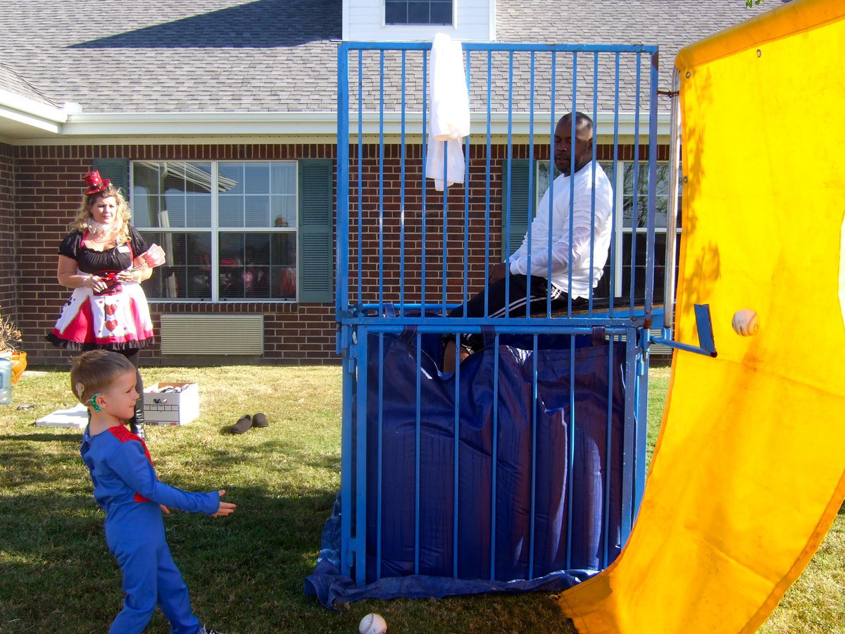 Image: Robert Bibles is ready for this young man to hit the mark and dunk him in the water.