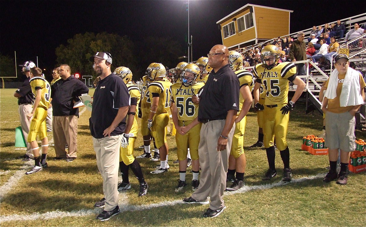 Image: Head coach Hank Hollywood breaks a smile as his Gladiators cruise in the final minutes during their 34-14 district win over Gateway.