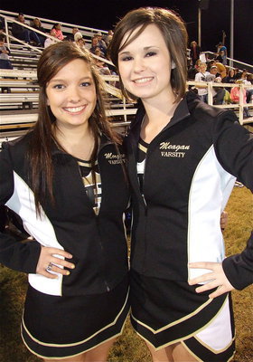 Image: Senior Gladiator cheerleaders Morgan Cockerham and Meagan Hooker are proud of all their classmates during Senior Night at Willis Field.