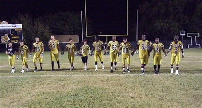 Image: Senior Walk: Gladiator seniors Hayden Wood(8), Chase Hamilton(2), Zackery Boykin(55), Cole Hopkins(9), Reid jacinto(11), Caden Jacinto(6), Ryheem Walker(10), John Hughes(62), Kelvin Joffre(80), Adrian Reed(64), Jalarnce Jamal Lewis(21) and Marvin Cox(3) take their final senior walk on Willis Field after defeating the Gateway Gators 34-14 during their final home game.