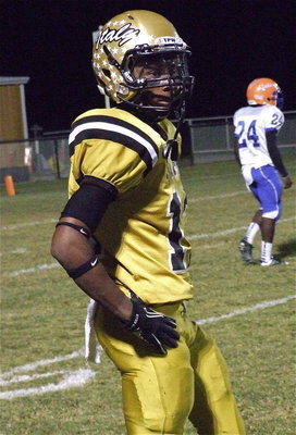 Image: Junior receiver Eric Carson(12) chats with Coach Hollywood during a break in the action.