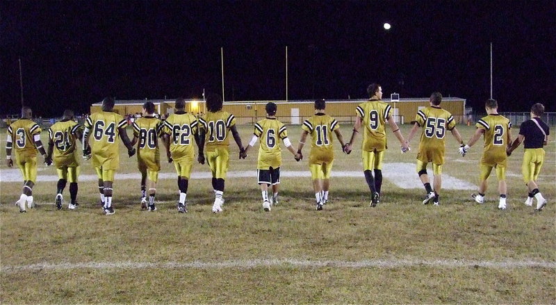 Image: Senior Gladiators take their final walk down Willis Field in a show of unity while reflecting on their football memories. (L-R) Marvin Cox(3), Jalarnce Jamal Lewis(21), Adrian Reed(64), Kelvin Joffre(80), John Hughes(62), Ryheem Walker(10), Caden Jacinto(6), Reid Jacinto(11), Cole Hopkins(9), Zackery Boykin(55), Chase Hamilton(2) and Hayden Woods(8). “Thanks for those memories, men!”